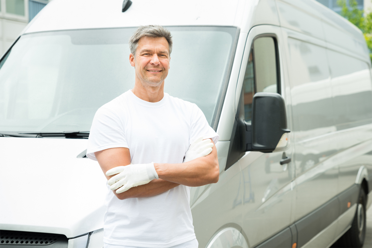 Painter With Arms Crossed In Front Of Van